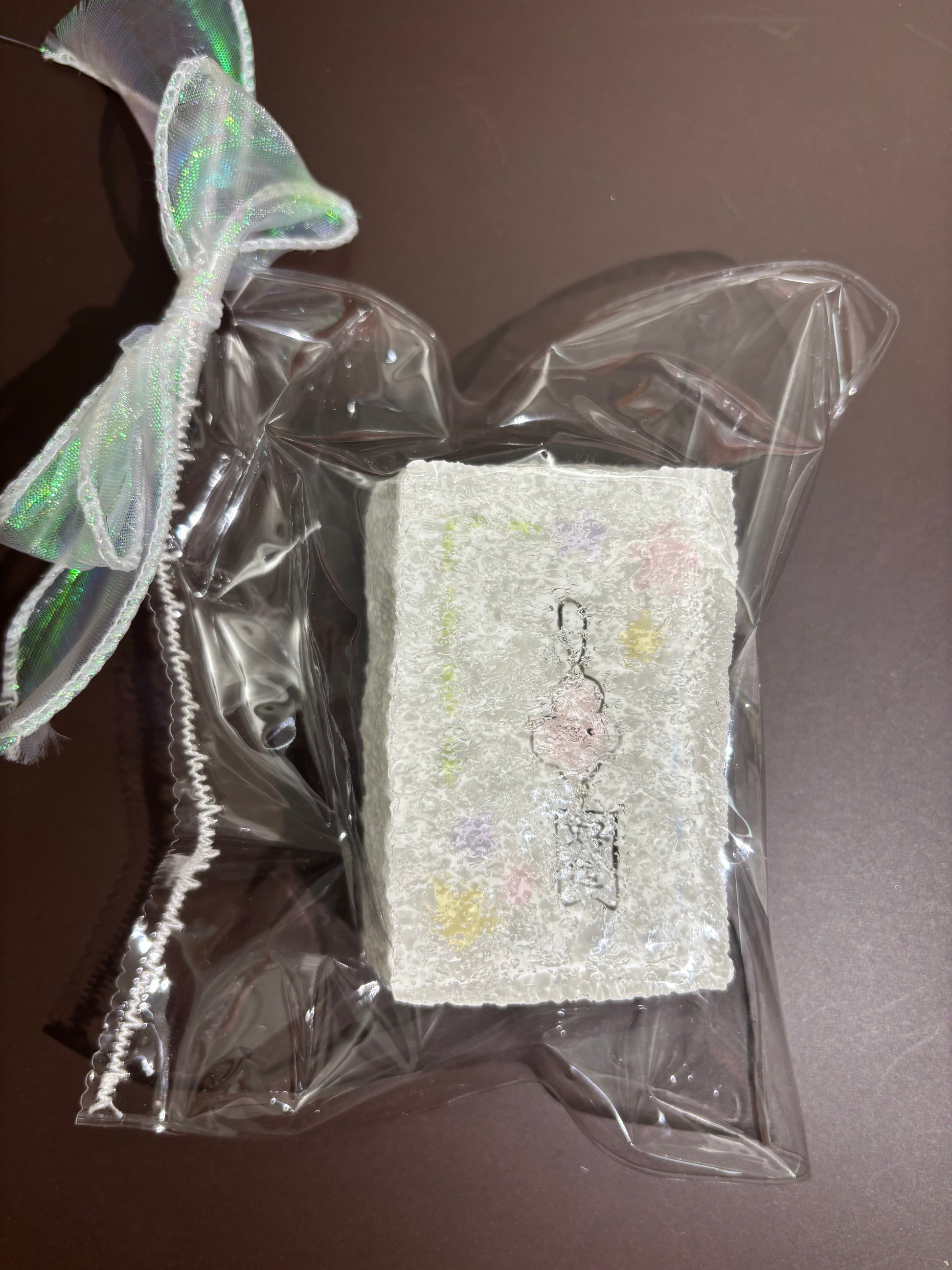 刺繍入り四角い布を透明袋に入れた商品（小さなキャラ柄）