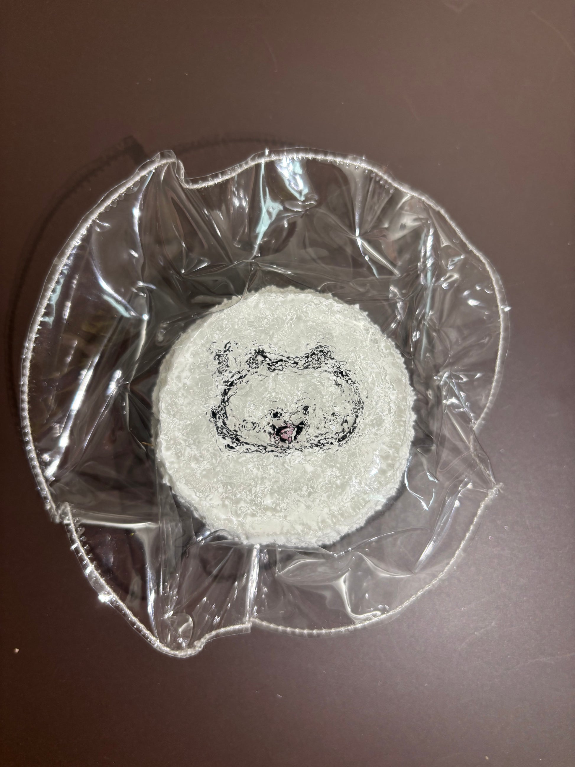 刺繍入り丸いコースター（クマの顔）を透明袋に入れた商品
